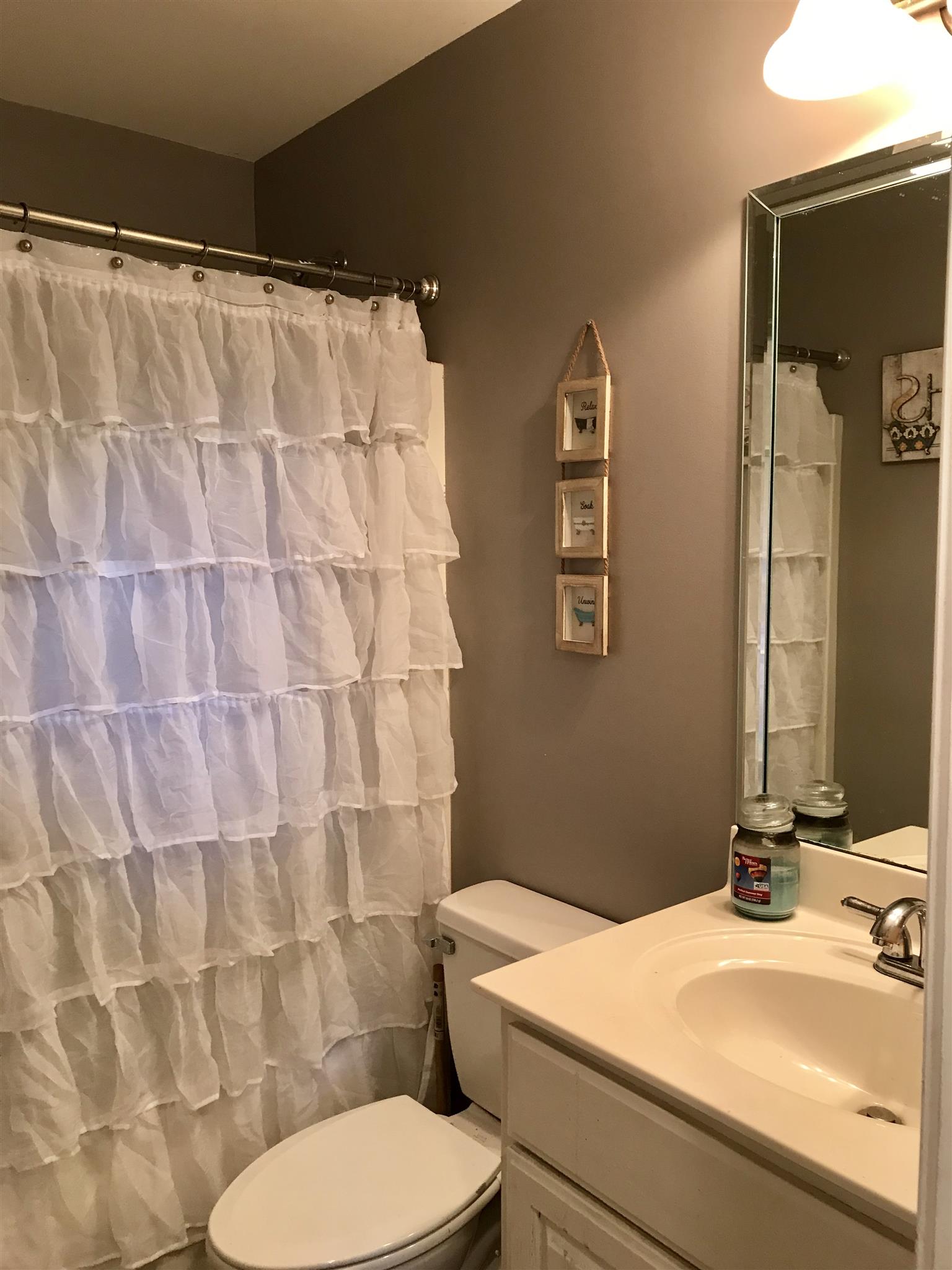 420 Nathan Street Lebanon, TN 37087 - Photo 9 of 14 a bathroom with a sink and toilet