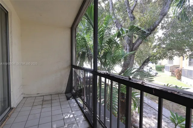 a view of a balcony with wooden fence and floor