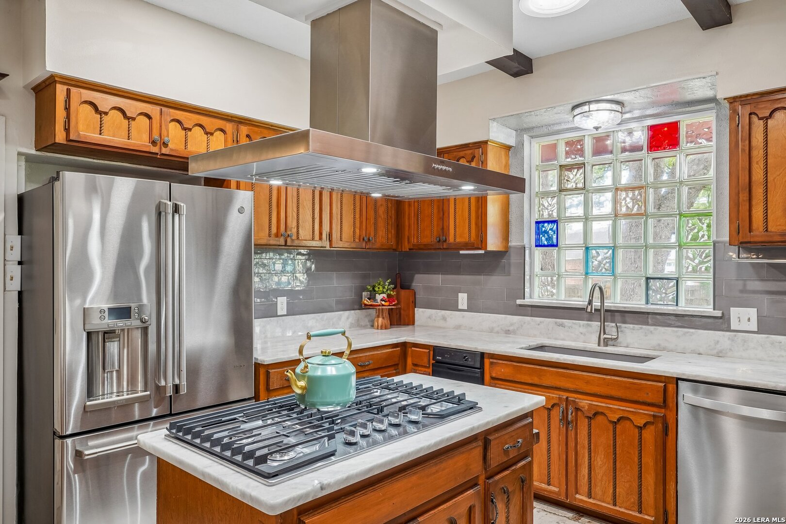 20632 Timber Rose Drive Garden Ridge, TX 78266 - Photo 23 of 46 a kitchen with stainless steel appliances granite countertop a sink stove and refrigerator