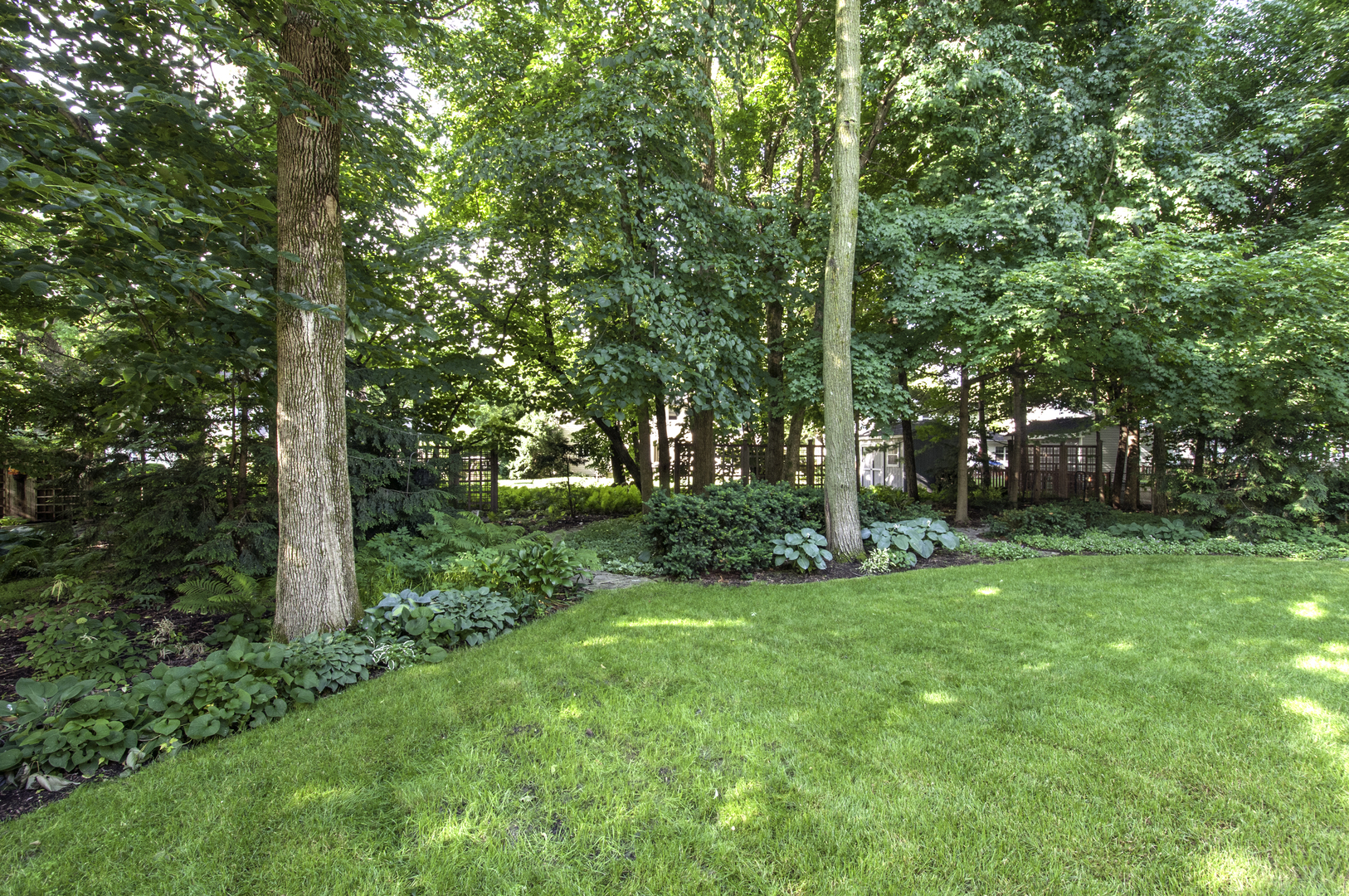 1750 Forest Ridge Road St. Charles, IL 60174 - Photo 3 of 22 a view of a backyard with garden