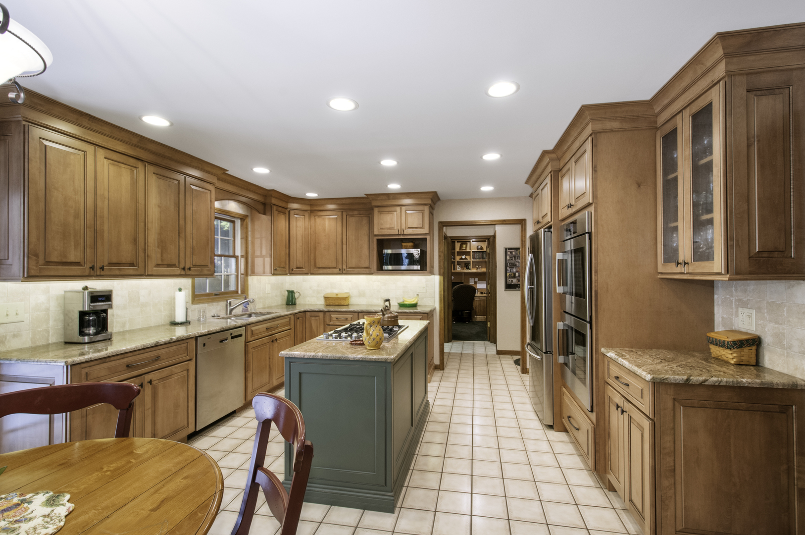 1750 Forest Ridge Road St. Charles, IL 60174 - Photo 5 of 22 a kitchen with stainless steel appliances kitchen island granite countertop a sink and cabinets