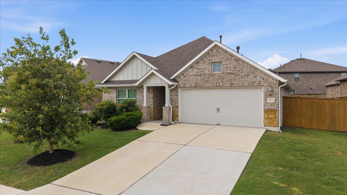 366 Cold Riv Run Kyle, TX 78640 - Photo 2 of 31 Brick exterior featuring a gabled roofline