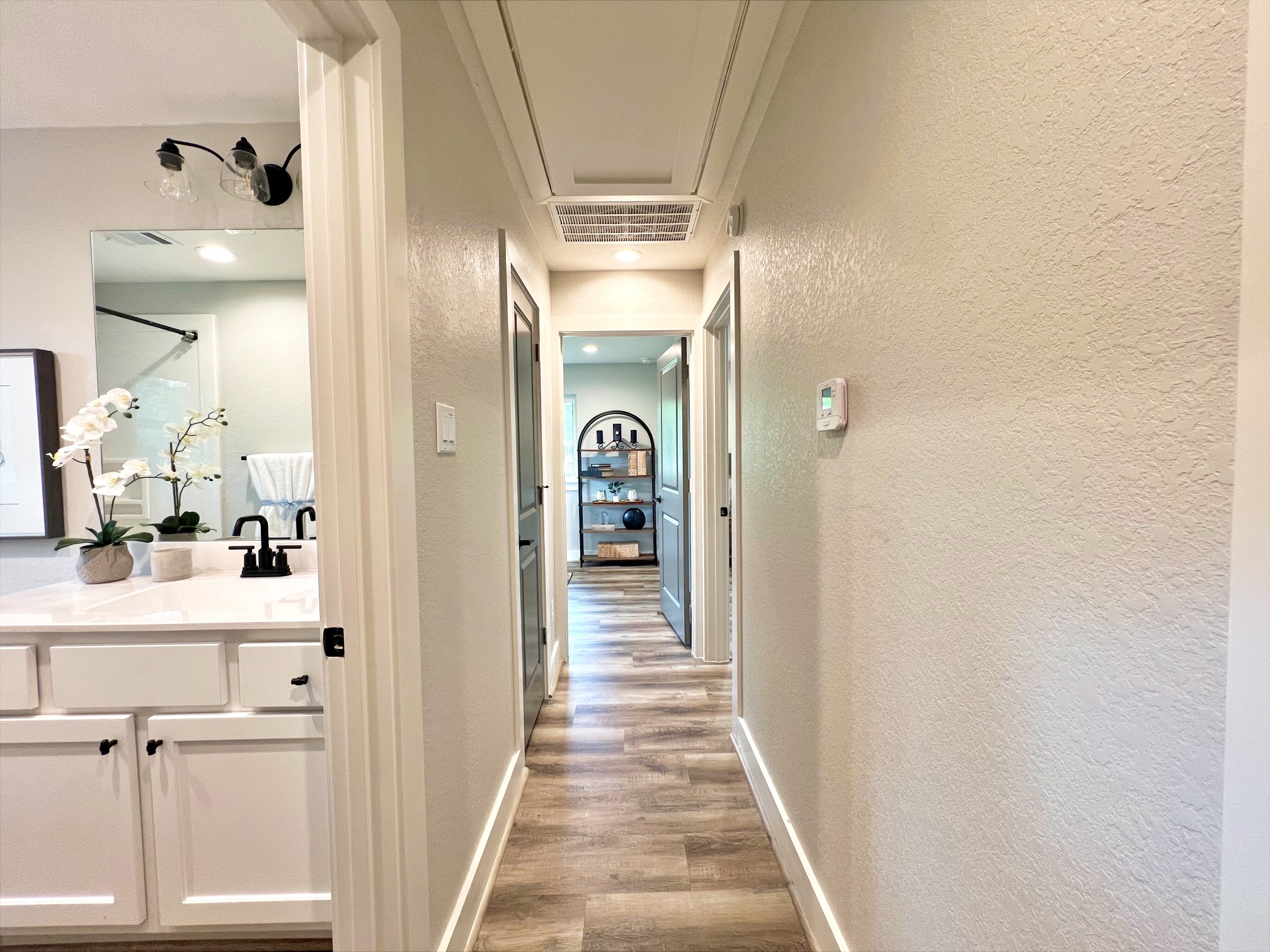 701 Cannan Drive Angleton, TX 77515 - Photo 9 of 25 Hall to bedrooms