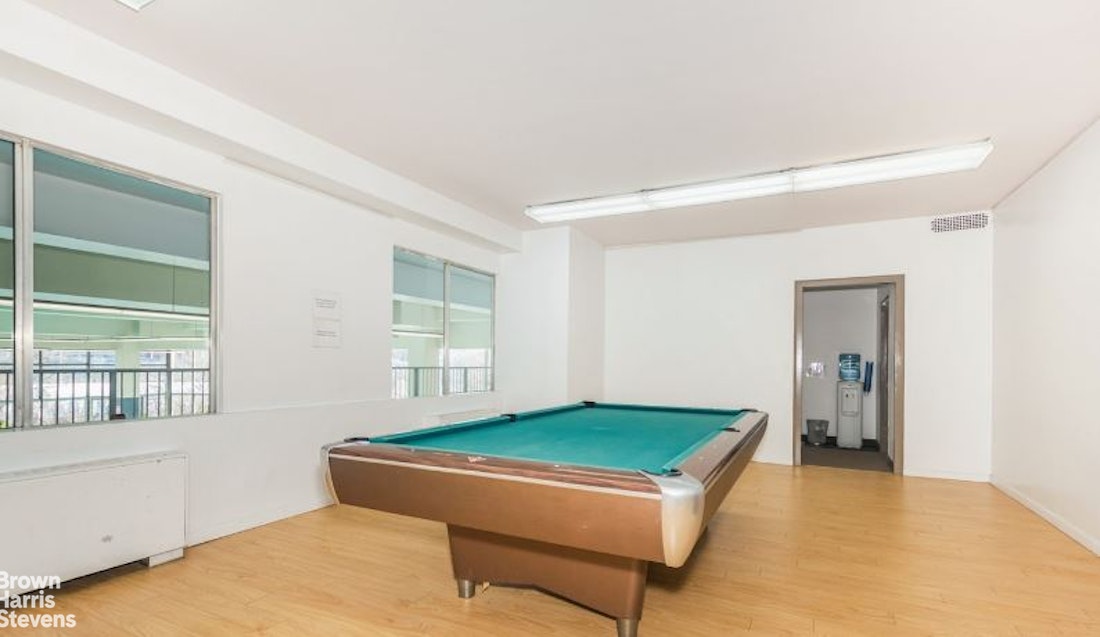 2500 Johnson Avenue, Unit 9P Bronx, NY 10463 - Photo 15 of 21 a room with pool table and windows