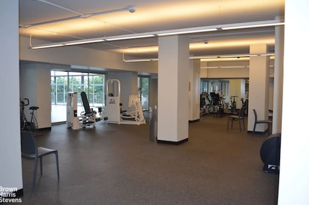 2500 Johnson Avenue, Unit 9P Bronx, NY 10463 - Photo 16 of 21 a view of a room with gym equipment