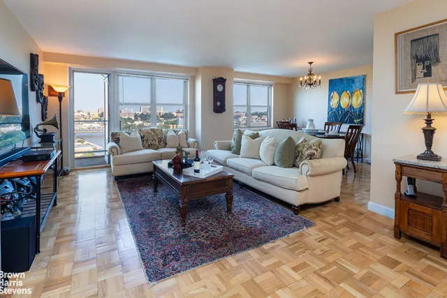 a living room with furniture and a rug