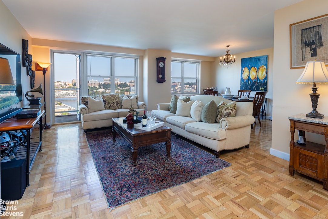 2500 Johnson Avenue, Unit 9P Bronx, NY 10463 - Photo 2 of 21 a living room with furniture and a rug