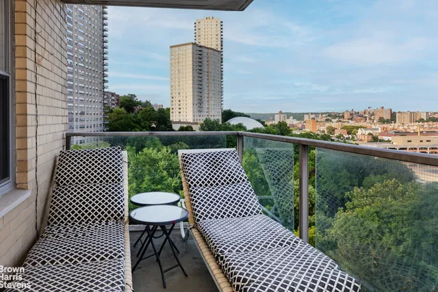 a view of a balcony with wooden floor