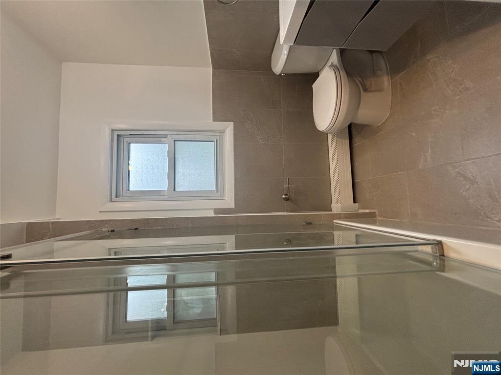 34 Warman Street, Unit 2 Montclair, NJ 07042 - Photo 7 of 11 a white toilet sitting next to a bathroom sink