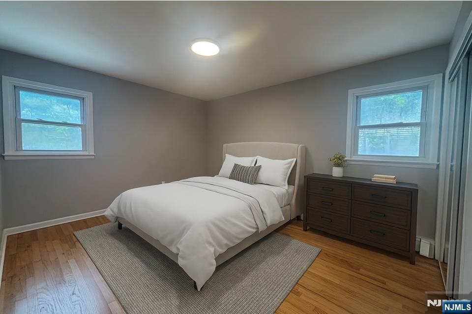 34 Warman Street, Unit 2 Montclair, NJ 07042 - Photo 8 of 11 a bedroom with a bed and a window