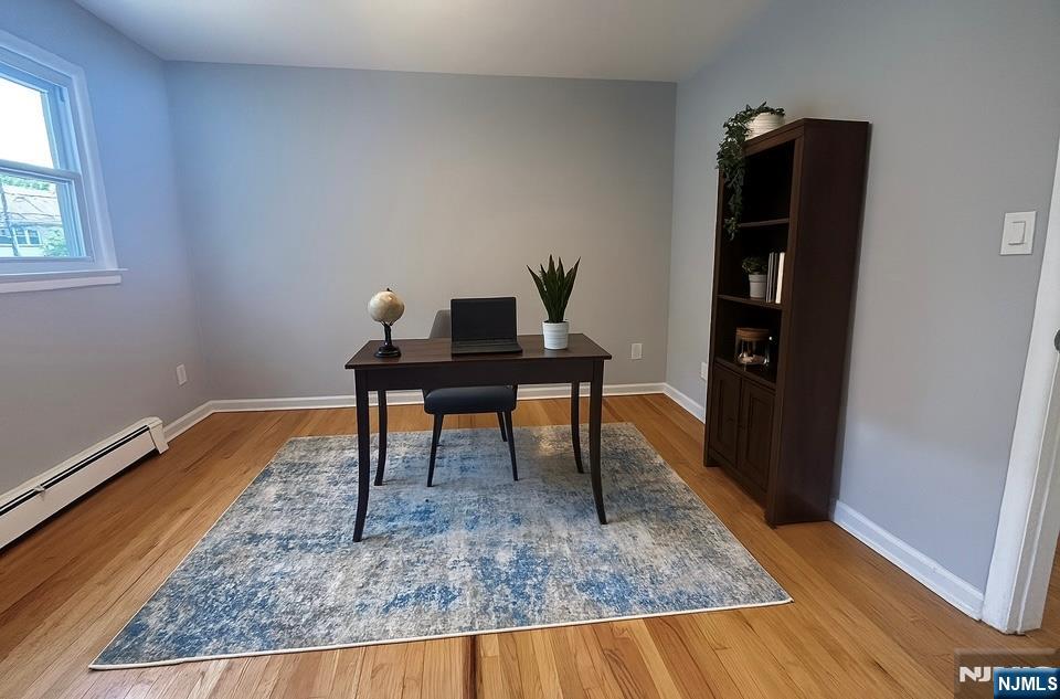 34 Warman Street, Unit 2 Montclair, NJ 07042 - Photo 9 of 11 a view of a workspace with furniture and wooden floor