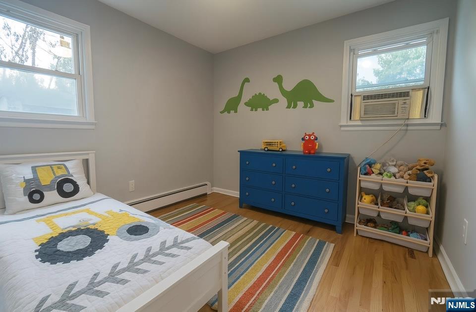 34 Warman Street, Unit 2 Montclair, NJ 07042 - Photo 10 of 11 a bedroom with a bed and a dresser