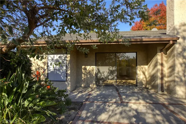 a view of a chairs and tables in patio