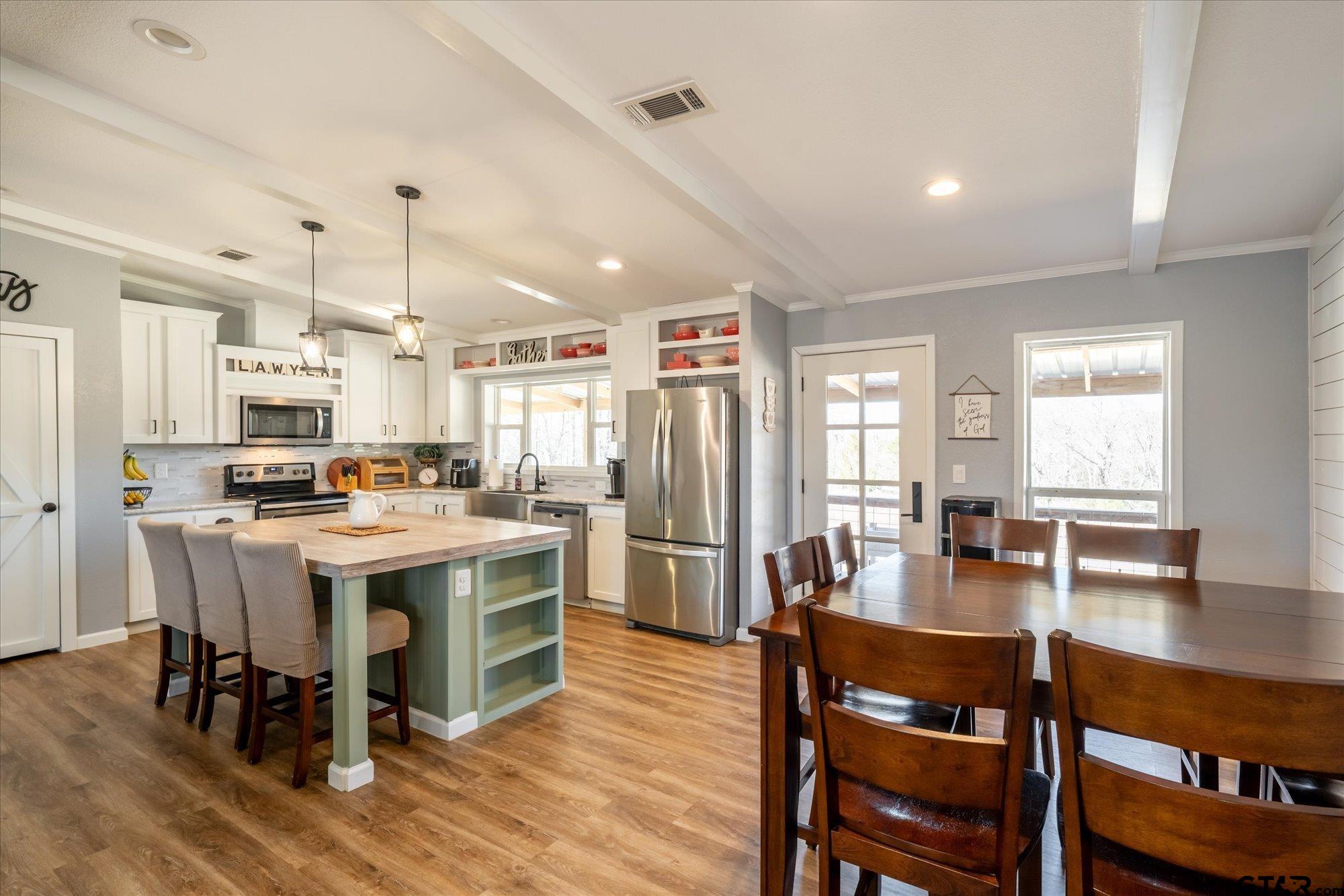 12095 Fm 317 Murchison, TX 75778 - Photo 6 of 34 a large kitchen with a table and chairs