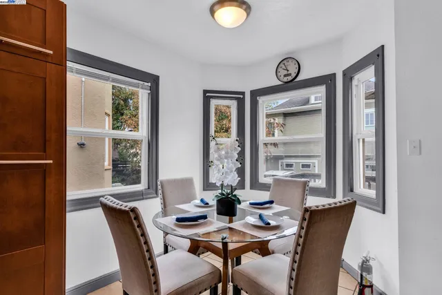 a spacious bedroom with a bed and a chandelier