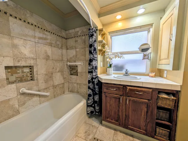 a bedroom with a bed and a chair