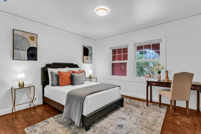 a bedroom with a bed and a couch