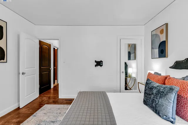 a bedroom with furniture and a window