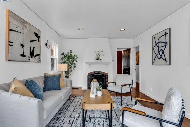 a living room with furniture and a rug