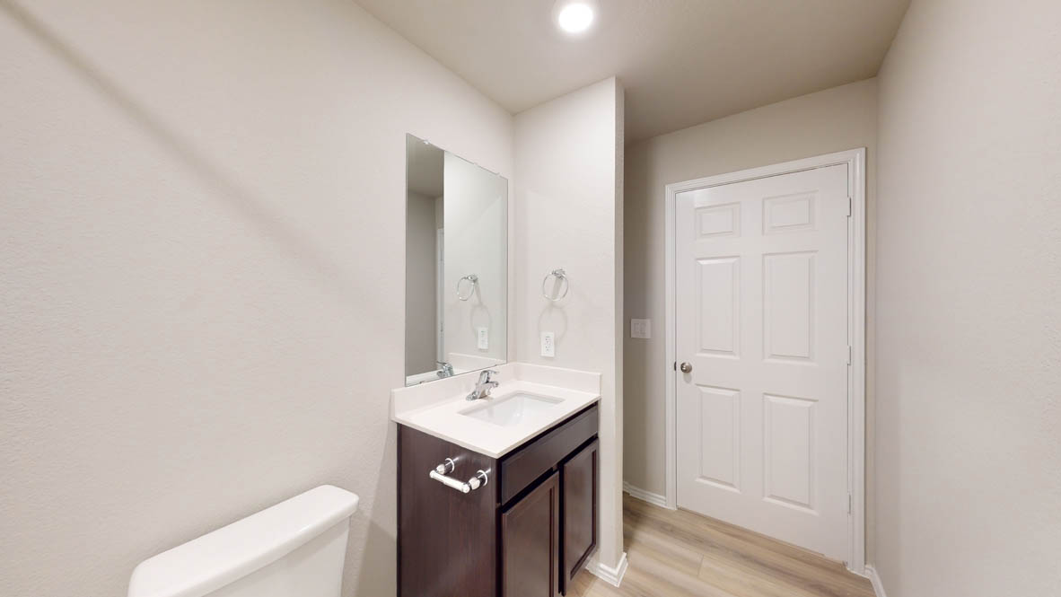 561 Hector Loop Georgetown, TX 78626 - Photo 26 of 30 a bathroom with a sink a toilet and shower