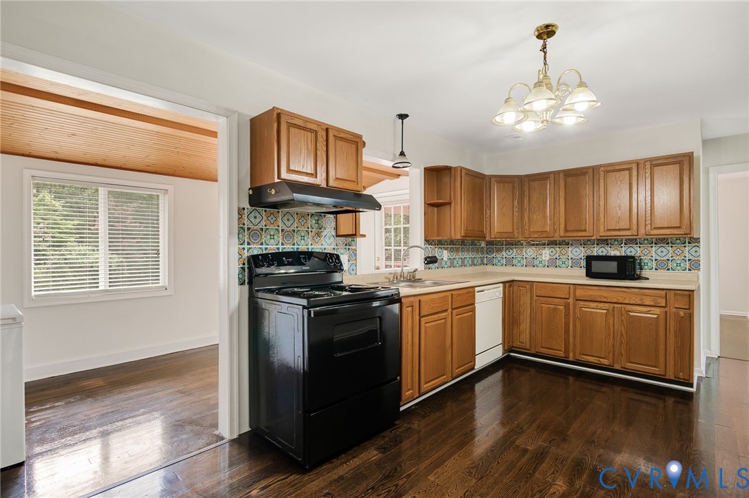 2876 Doctors Road Louisa, VA 23093 - Photo 12 of 36 a kitchen with stainless steel appliances granite countertop wooden cabinets a stove a sink and dishwasher