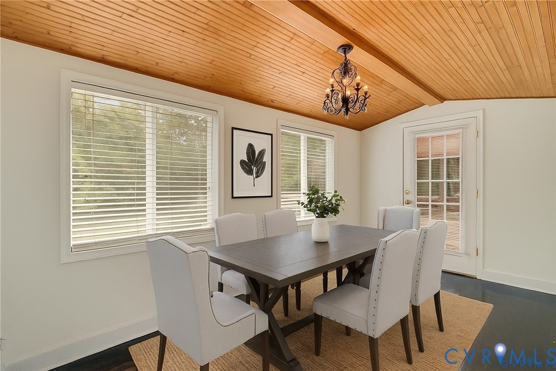 2876 Doctors Road Louisa, VA 23093 - Photo 14 of 36 a view of a dining room with furniture window and wooden floor