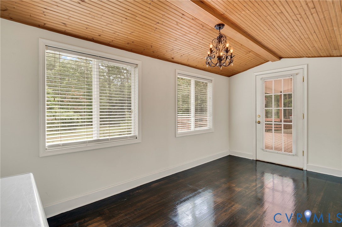 2876 Doctors Road Louisa, VA 23093 - Photo 15 of 36 a view of a livingroom with wooden floor and windows