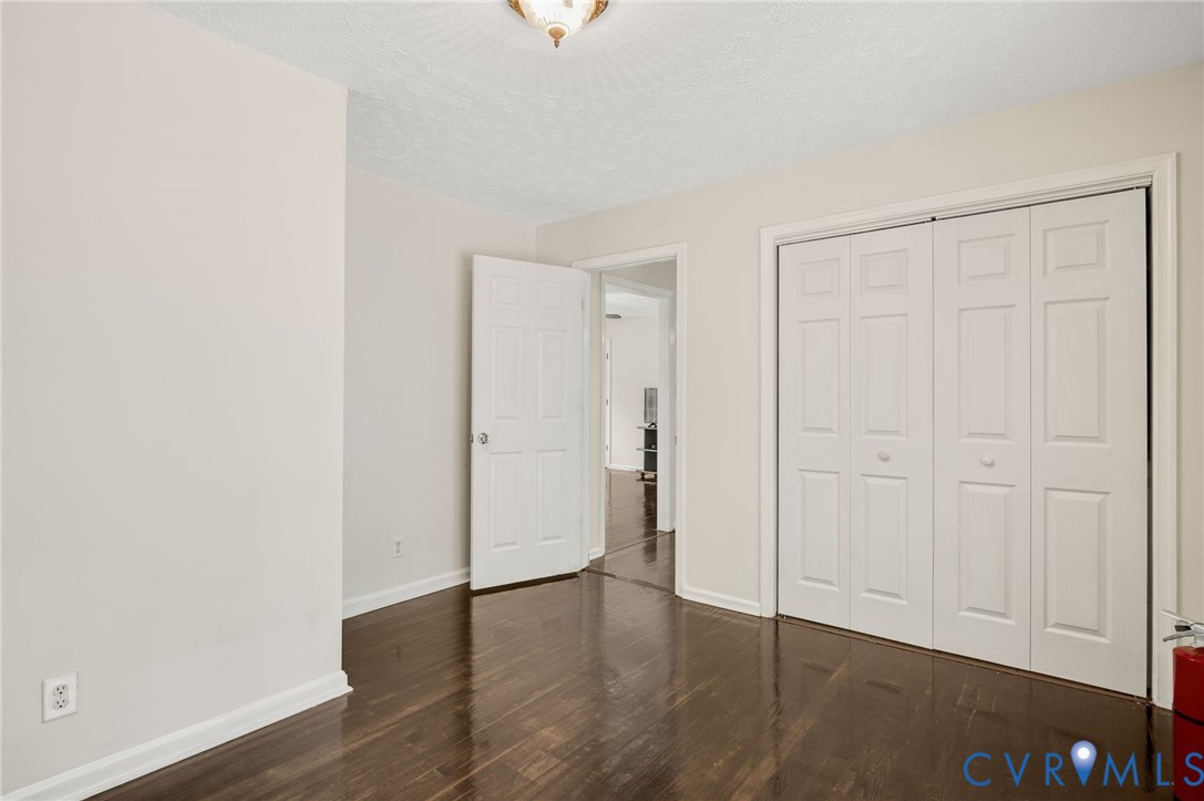 2876 Doctors Road Louisa, VA 23093 - Photo 10 of 36 an empty room with wooden floor and closet area