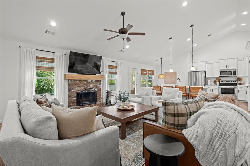 167 Lawrence Drive Villa Rica, GA 30180 - Photo 1 of 43 a living room with furniture a fireplace and a flat screen tv