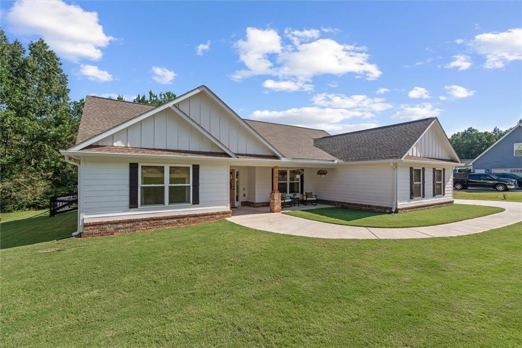 167 Lawrence Drive Villa Rica, GA 30180 - Photo 11 of 43 a front view of a house with a garden