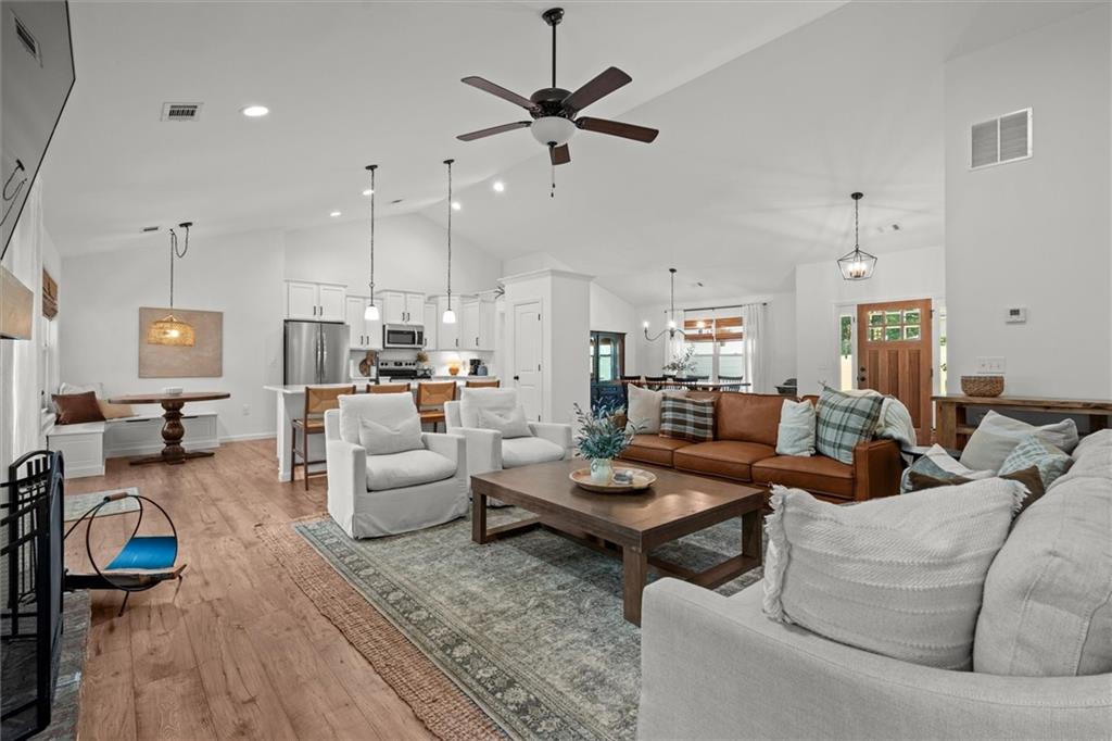 167 Lawrence Drive Villa Rica, GA 30180 - Photo 14 of 43 a living room with furniture kitchen view and a wooden floor