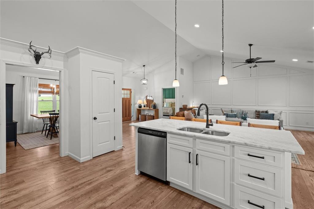 167 Lawrence Drive Villa Rica, GA 30180 - Photo 17 of 43 a kitchen with a sink cabinets and wooden floor