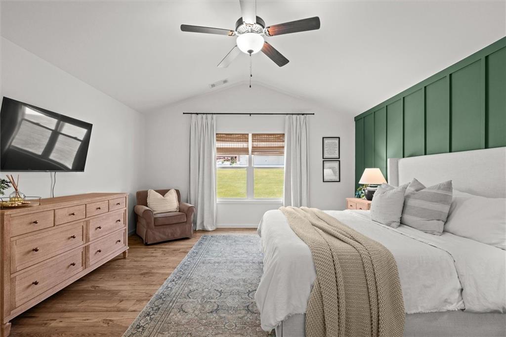 167 Lawrence Drive Villa Rica, GA 30180 - Photo 21 of 43 a bedroom with a bed dresser and a window