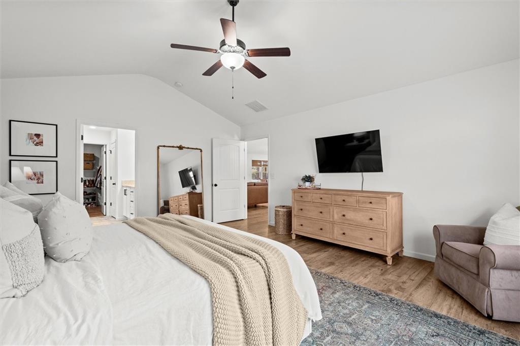 167 Lawrence Drive Villa Rica, GA 30180 - Photo 22 of 43 a bedroom with a bed window and a flat screen tv