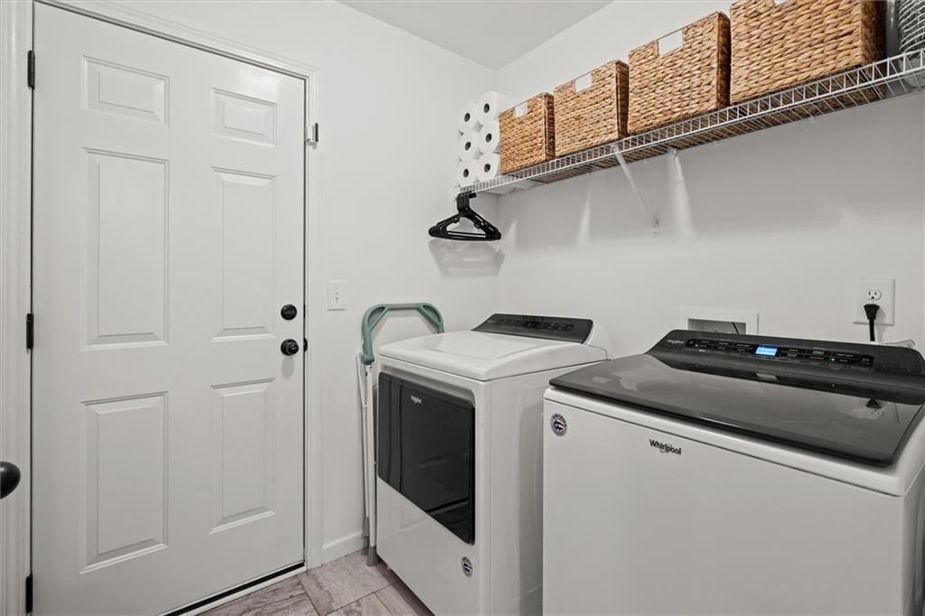 167 Lawrence Drive Villa Rica, GA 30180 - Photo 27 of 43 a view of storage and utility room with washer and dryer