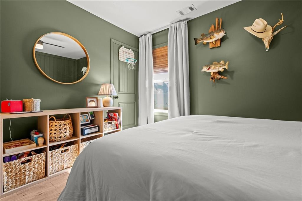 167 Lawrence Drive Villa Rica, GA 30180 - Photo 30 of 43 a bed room with a bed and a mirror