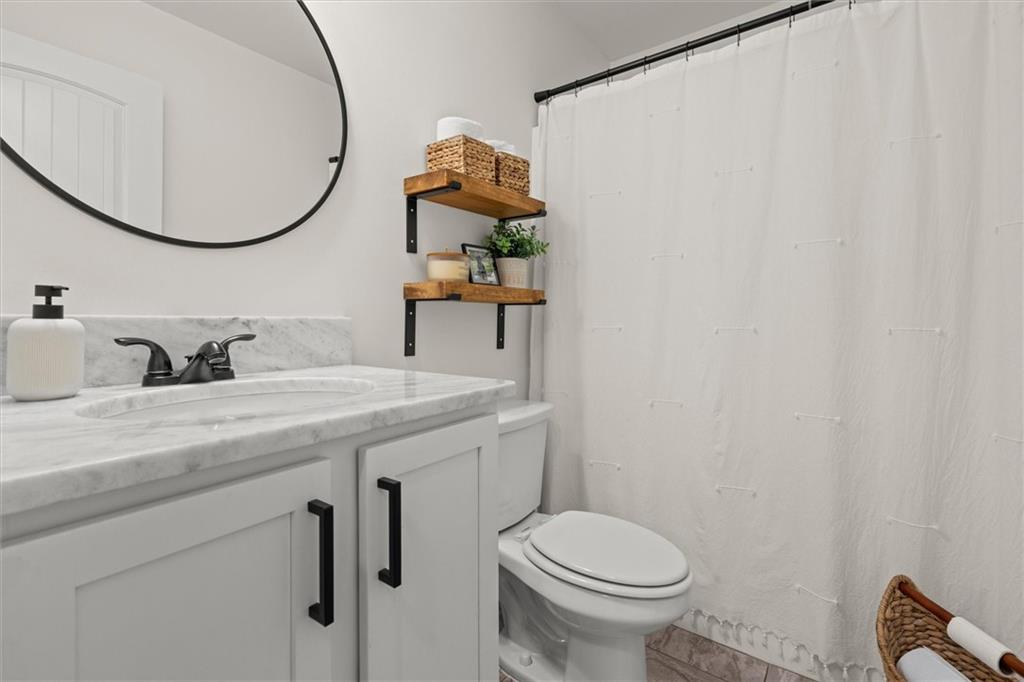 167 Lawrence Drive Villa Rica, GA 30180 - Photo 33 of 43 a bathroom with a sink toilet and mirror