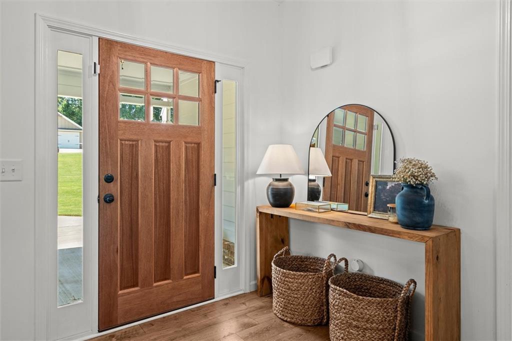 167 Lawrence Drive Villa Rica, GA 30180 - Photo 4 of 43 a close view of shoes a chair and a window in a room