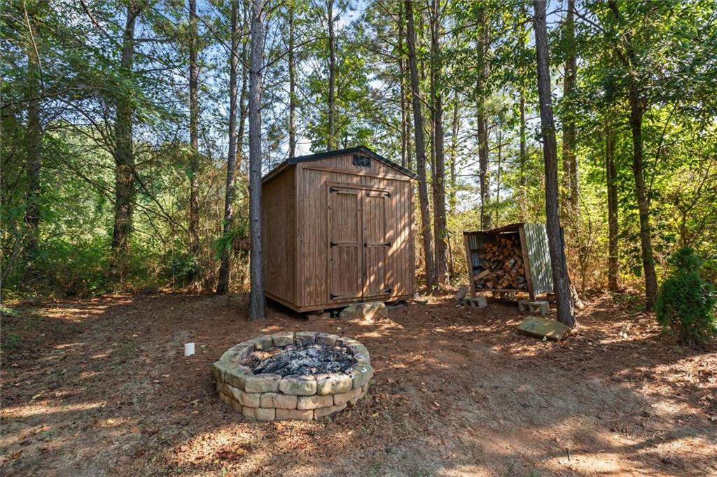 167 Lawrence Drive Villa Rica, GA 30180 - Photo 41 of 43 a backyard of a house with lots of green space