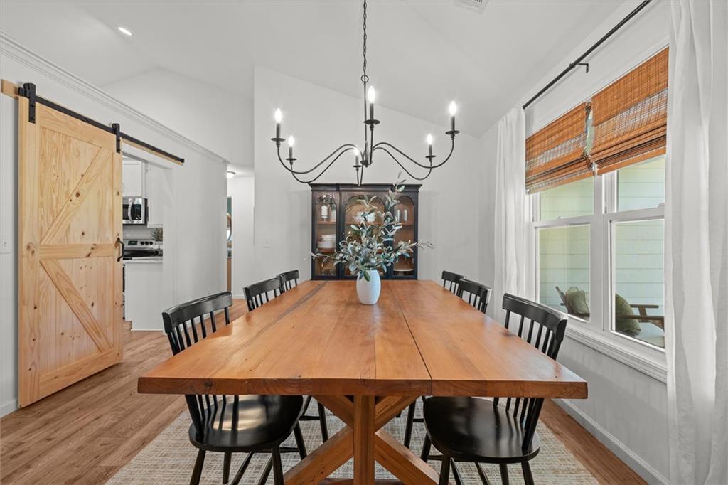 167 Lawrence Drive Villa Rica, GA 30180 - Photo 8 of 43 a view of a dining room with furniture window and wooden floor