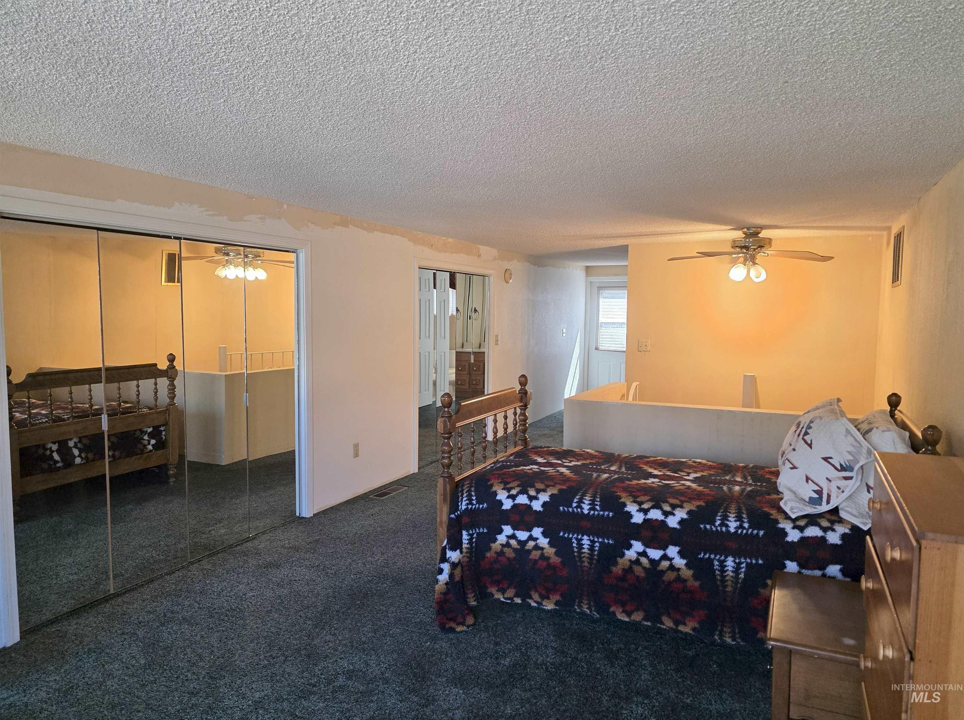 209 Harding Street Asotin, WA 99402 - Photo 17 of 29 Bedroom featuring a textured ceiling and carpet