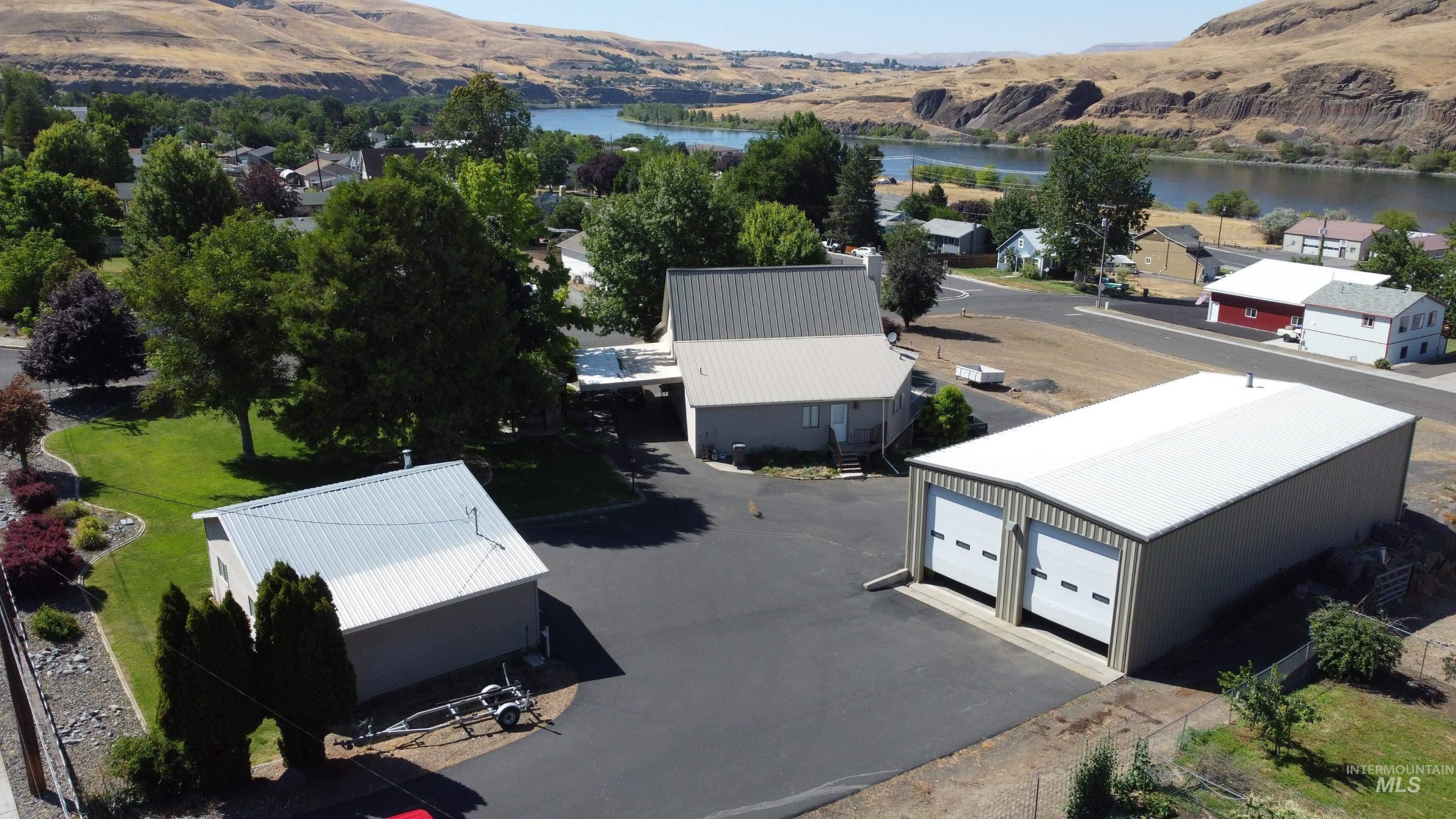 209 Harding Street Asotin, WA 99402 - Photo 2 of 29 Aerial perspective of suburban area with a water and mountain view