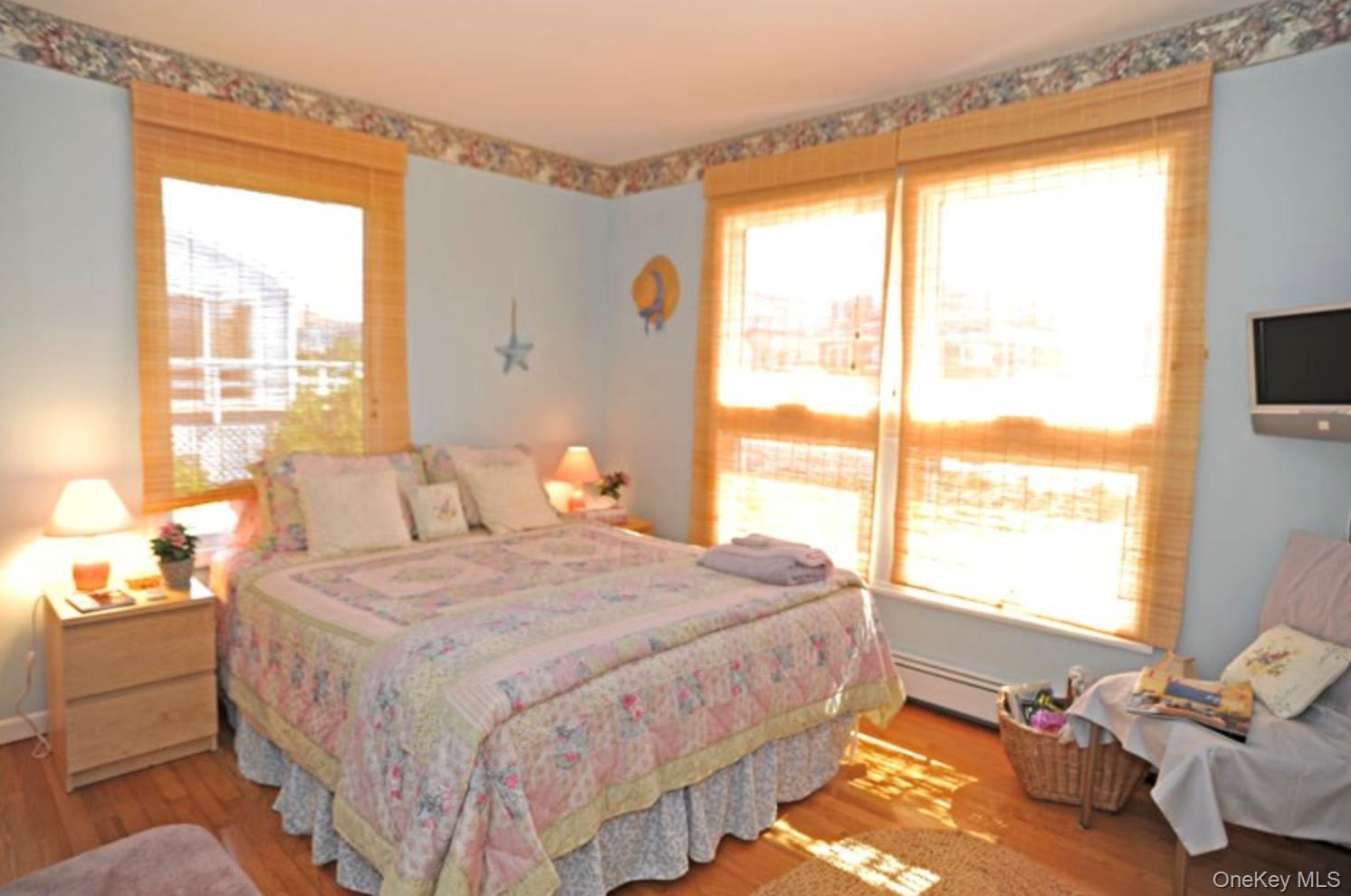 900 Dune Road Westhampton Beach, NY 11978 - Photo 7 of 14 a bedroom with a bed and a window