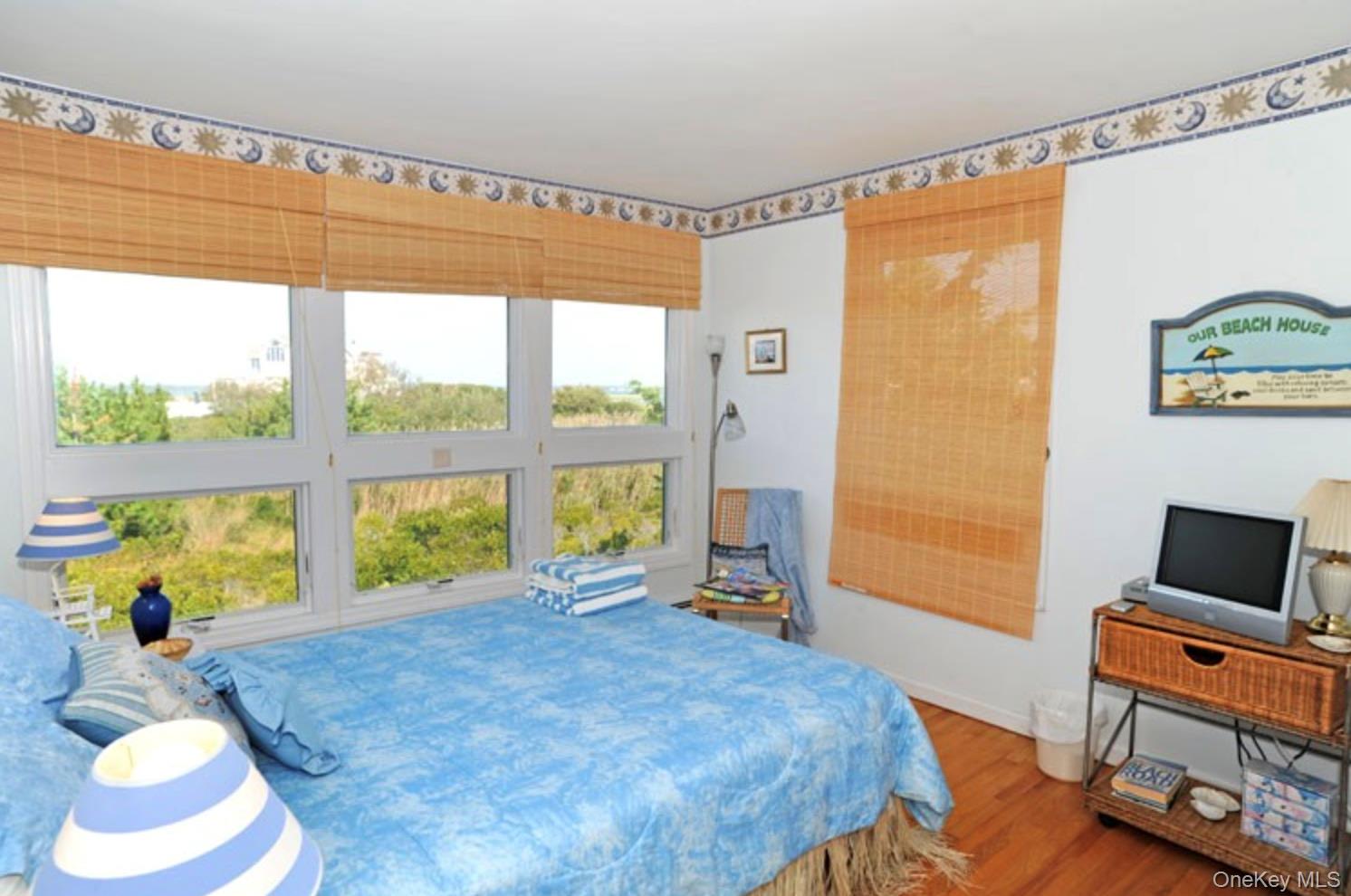 900 Dune Road Westhampton Beach, NY 11978 - Photo 8 of 14 a bedroom with a bed and a window