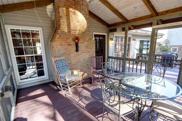 a kitchen with granite countertop a sink stove and cabinets