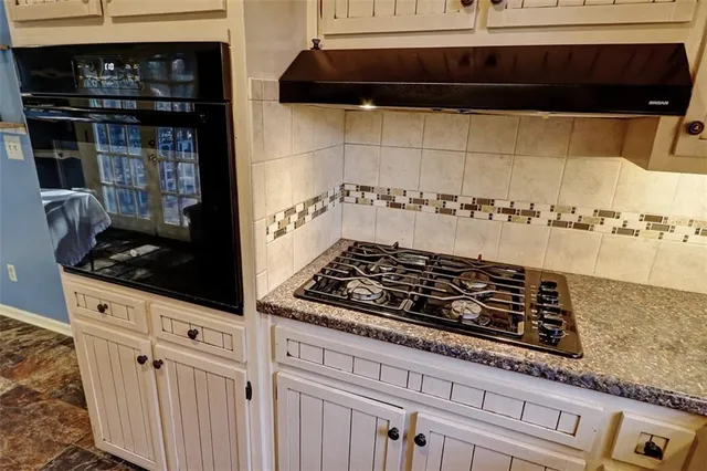 a view of a refrigerator in kitchen