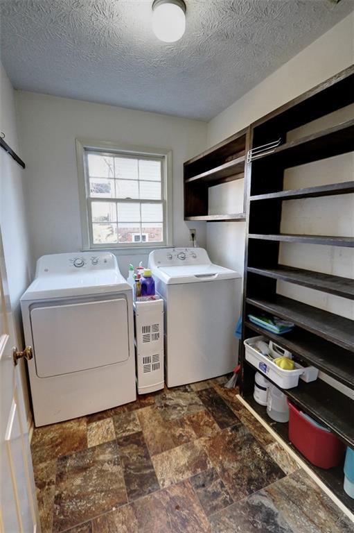 253 Newport Road Southwest Lilburn, GA 30047 - Photo 14 of 40 a utility room with dryer and washer