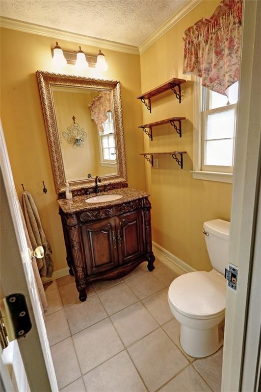 253 Newport Road Southwest Lilburn, GA 30047 - Photo 17 of 40 a bathroom with a toilet mirror vanity and a sink