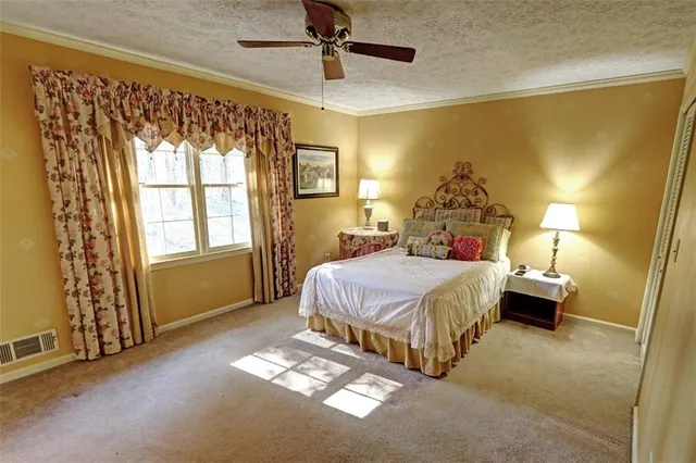 a living room with a bed and a table