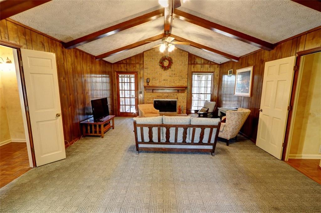253 Newport Road Southwest Lilburn, GA 30047 - Photo 3 of 40 a living room with furniture fireplace and a window